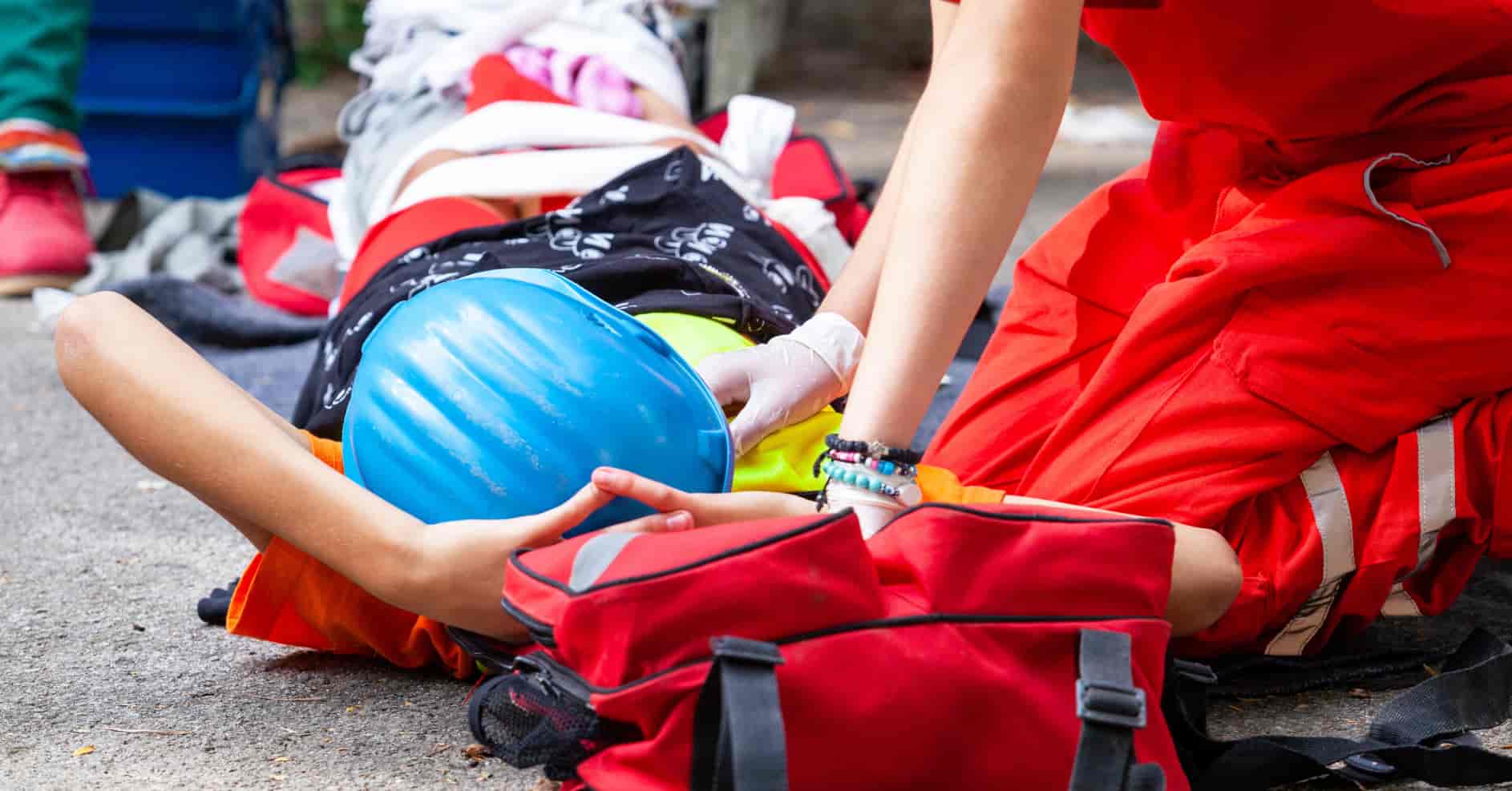 First aider quickly responding to emergency situation in workplace