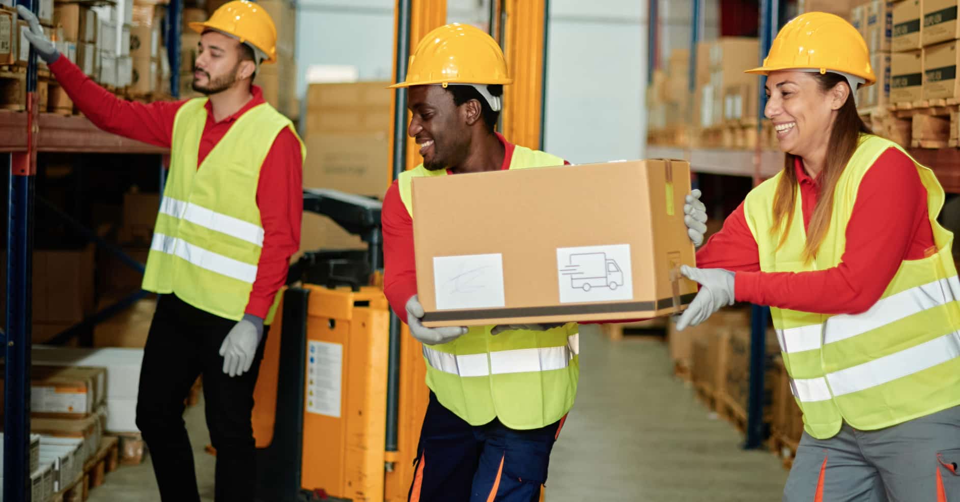 Employee using correct lifting technique while moving a heavy box in a warehouse.