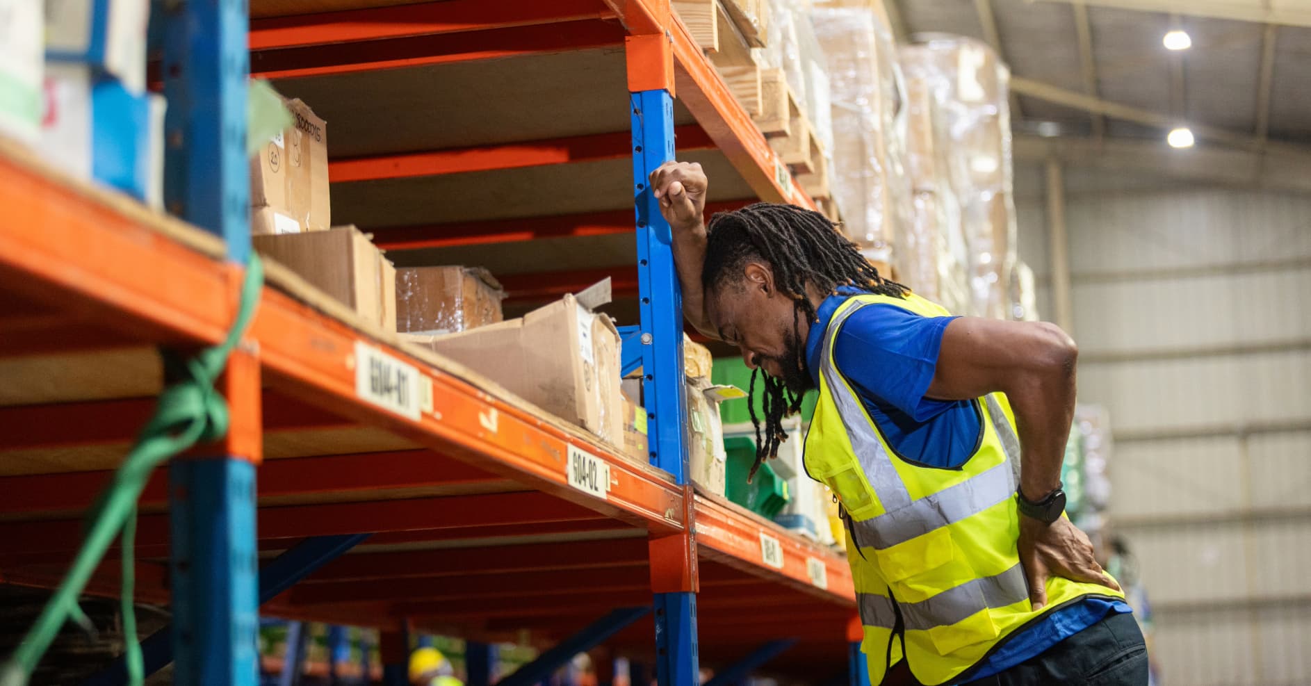 First aid planning discussion in a UK warehouse environment