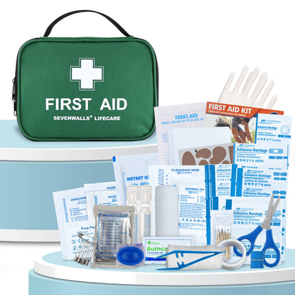 First aid kit with various supplies on a white background
