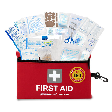 Red first aid kit with various supplies on a white background