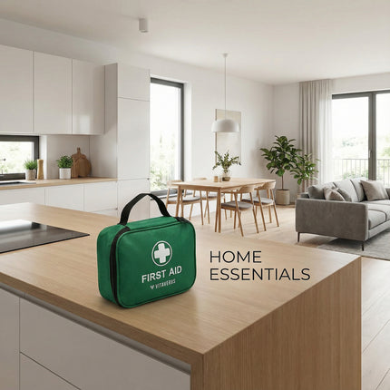 Green first aid kit on a kitchen counter with 'Home Essentials' text