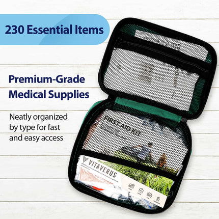 Open first aid kit with visible medical supplies on a wooden surface