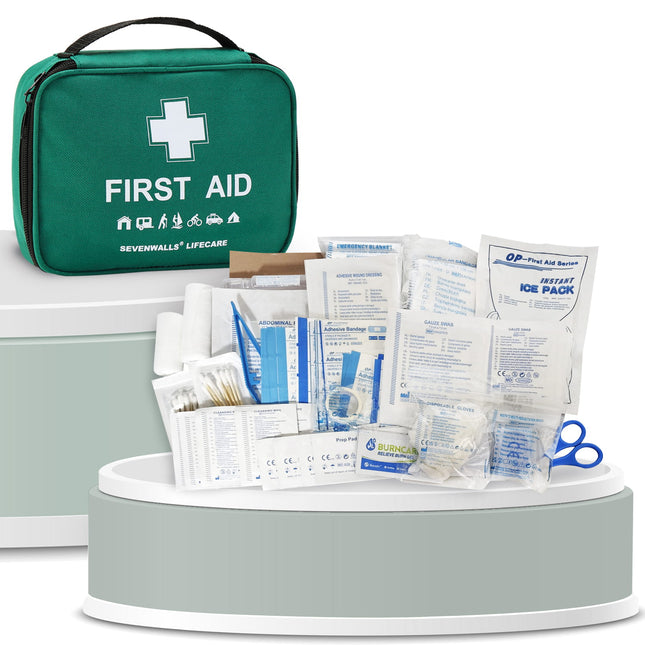 First aid kit with various supplies on a white background