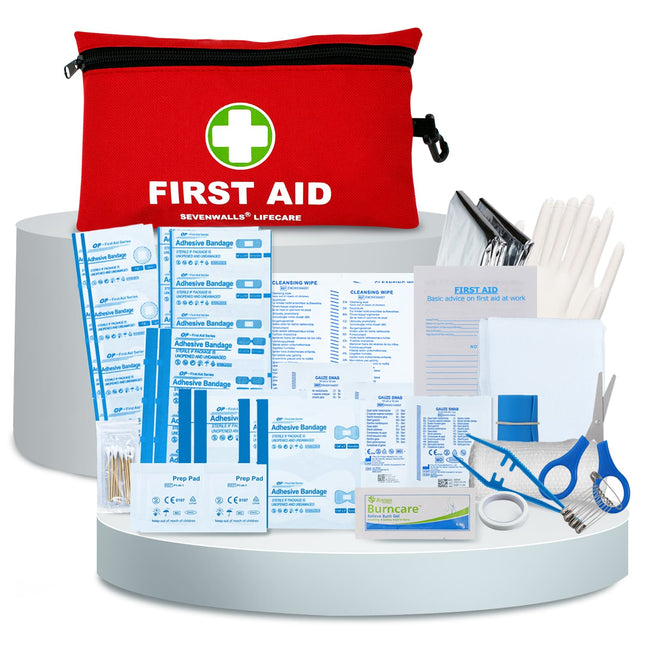 First aid kit with various supplies on a white background