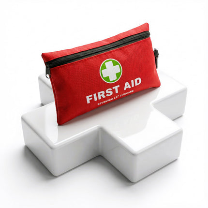 Red first aid kit with 'First Aid' text on a white geometric background