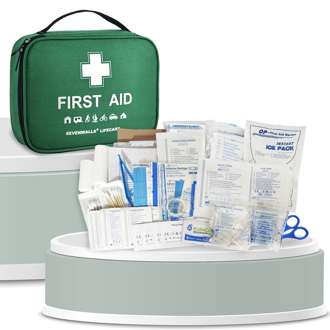 First aid kit with various supplies on a white background