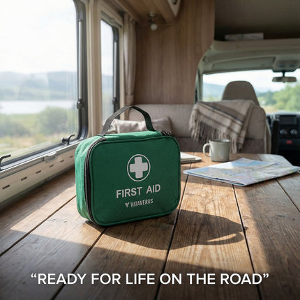 Green first aid kit on a wooden table inside a vehicle with scenic view