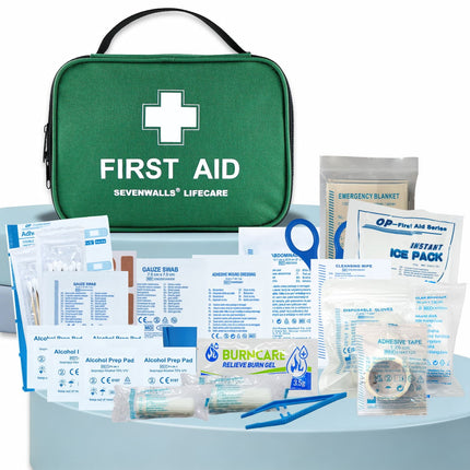 First aid kit with various components on a white background