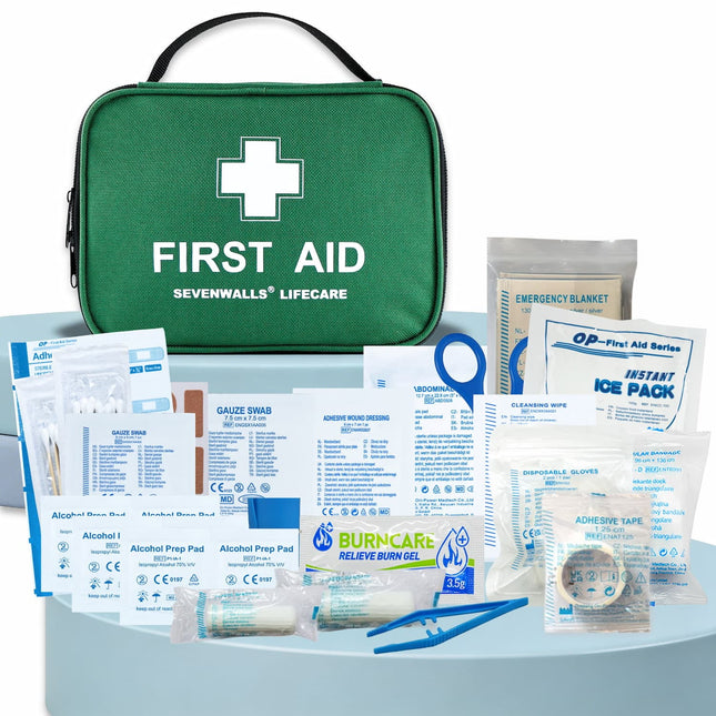 First aid kit with various components on a white background