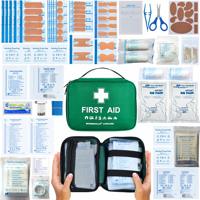 Collection of first aid supplies including bandages, scissors, and ice packs on a white background.