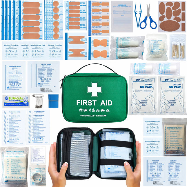 Collection of first aid supplies including bandages, scissors, and ice packs on a white background.