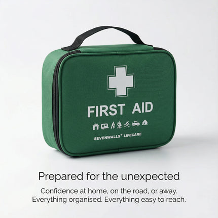 Green first aid kit with a white cross symbol on a light gray background