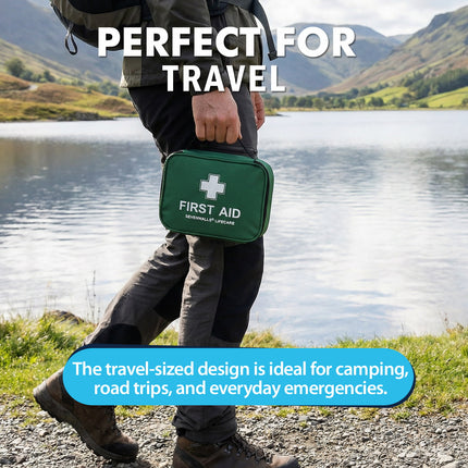 Person holding a green first aid kit with a scenic background