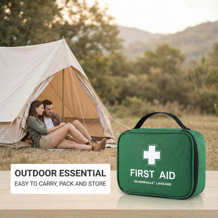 Green first aid kit with a couple sitting by a tent in a scenic outdoor setting.